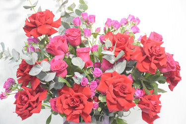 Red Roses and Pink Spray Roses in Ceramic Vase